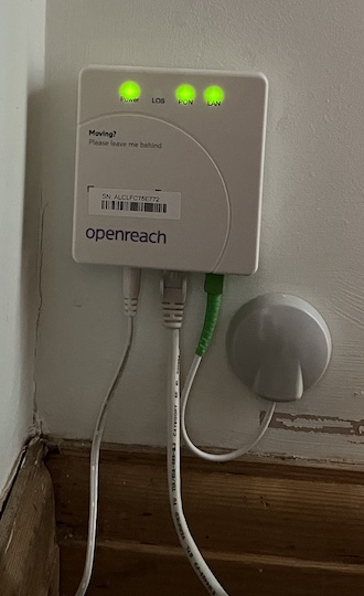 Optical Network Terminal (ONT). Connections from left to right are power, router and incoming fibre. LEDs are Power, LOS (only lit if there's a problem), PON (connected to exchange), LAN (connected to router).